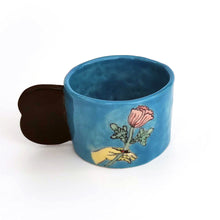 Load image into Gallery viewer, <transcy>Imustan Mug “hand holding floweres/window”</transcy>